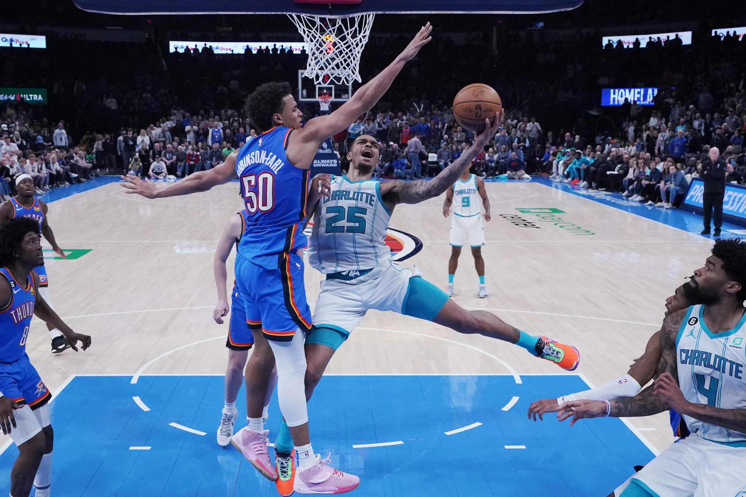 Charlotte Hornets' forward P.J. Washington (25) shoots as Oklahoma City Thunder forward Jeremiah Robinson-Earl (50) defends in the second half of an NBA basketball game Tuesday, March 28, 2023, in Oklahoma City. (AP Photo/Sue Ogrocki)