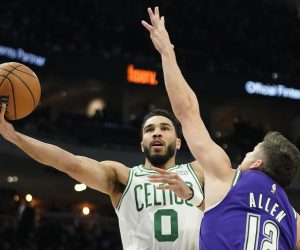 Boston Celtics' Jayson Tatum (0) shoots against Milwaukee Bucks' Grayson Allen during the first half of an NBA basketball game Thursday, March 30, 2023, in Milwaukee. (AP Photo/Aaron Gash)
