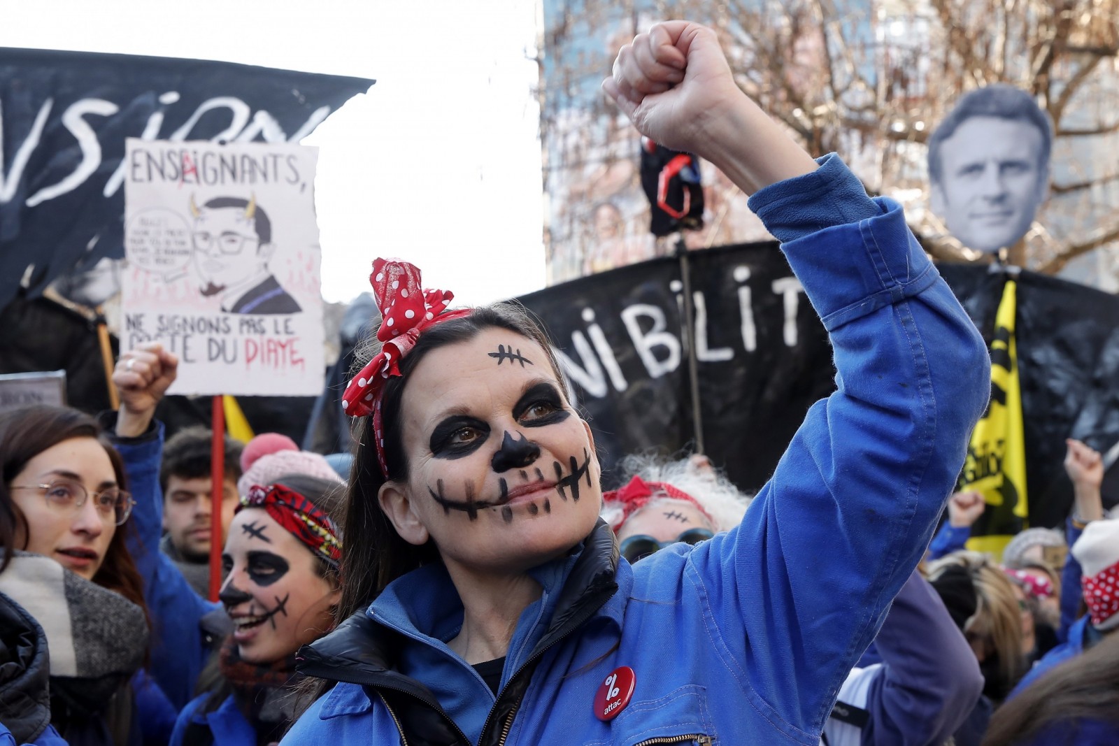 epa10452767 Les Rosies Group, wearing headband of Rosie the Rieveter, demonstrate against the planned pension reform, in Paris, France, 07 February 2023. The French government plans to raise the minimum retirement age from 62 to 64 by 2030.  EPA/TERESA SUAREZ