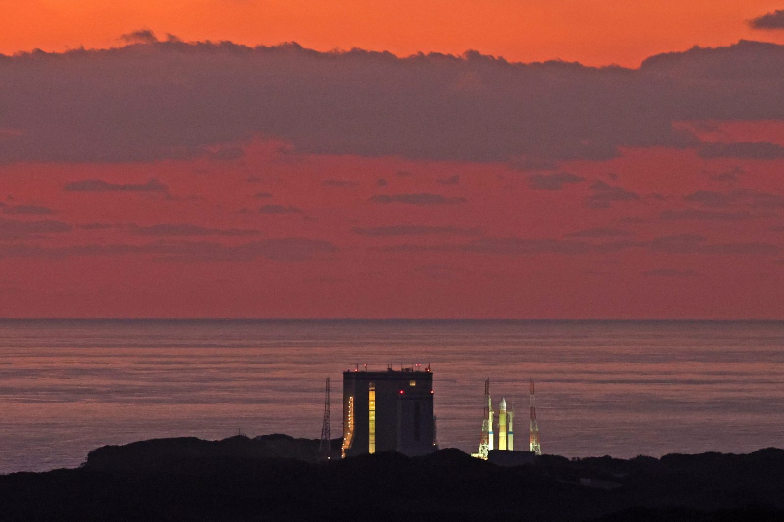 epa10472035 Japan's new H3 rocket stands on the launch pad at dawn at the Tanegashima Space Center located on Tanegashima island, Kagoshima Prefecture, southwestern Japan, 17 February 2022. Despite the ignition of the H3 rocket's main engine, the boosters failed to ignite forcing the cancellation of the launch.  EPA/JIJI PRESS JAPAN OUT EDITORIAL USE ONLY/