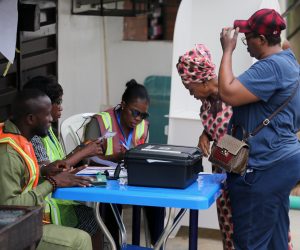 epa10490371 Electoral officers attend to voters at a polling station during the general elections, in the Ikeja district of Lagos, Nigeria, 25 February 2023. Nigerians head to the polls on 25 February to elect a new president, vice president and members of the Senate and House of Representatives.  EPA/AKINTUNDE AKINLEYE