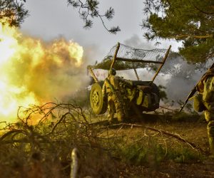 epa10492581 Ukrainian servicemen of the 68th Separate Jager Infantry Brigade "Oleksa Dovbush" fire a howitzer towards Russian positions, at an undisclosed location in the Donetsk region, eastern Ukraine, 26 February 2023. Russian troops entered Ukraine on 24 February 2022 starting a conflict that has provoked destruction and a humanitarian crisis.  EPA/OLEG PETRASYUK