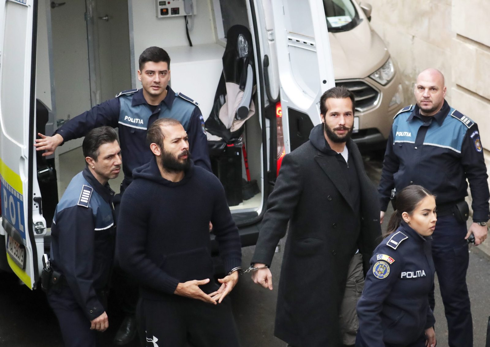 epa10493454 Andrew Tate (L) and his brother Tristan Tate (R) attend their hearing at the Bucharest Court, in Bucharest, Romania, 27 February 2023. The Bucharest Court on 21 February decided to extend the detention order in the case of the Tate brothers. Andrew Tate and his brother Tristan were arrested as a result of the DIICOT (Directorate for Investigating Organized Crime and Terrorism) inquiry under the charges of human trafficking and intention to form an organized crime group. Romanian police stated that the two brothers and their associates coerced victims for creating a paid pornography service for social media platforms.  EPA/ROBERT GHEMENT