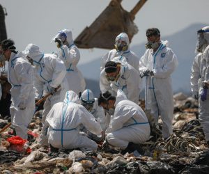 epa10494750 Police officers comb through garbage, searching for the remains of murdered model and influencer Abby Choi in a landfill site in Hong Kong, China, 28 February 2023. Choi’s gruesome murder came to light last week after police found two severed legs, believed to be hers, inside a flat, followed by a skull and several ribs discovered in a large soup pot seized from the property.  EPA/JEROME FAVRE