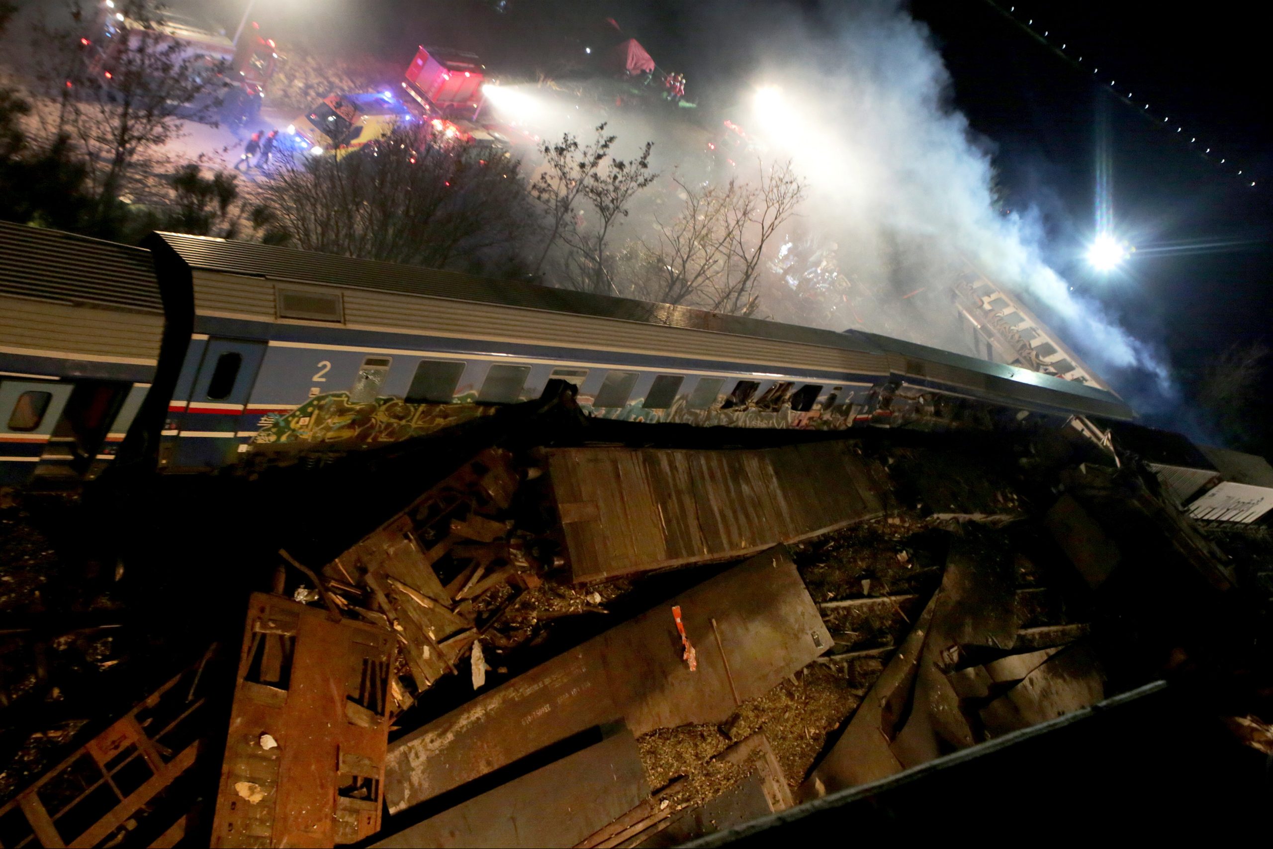 epa10496179 Firefighters and rescue crews work to extricate passengers from trains after a coallision near Larissa city, Greece, 01 March 2023. The two trains – a passenger train travelling from Athens to the northern city of Thessaloniki, and a cargo train from Thessaloniki to Larissa, collided head-on outside the central Greek city, Konstantinos Agorastos, the governor of the Thessaly region told local media. Sixteen people have been killed and at least 85 injured, and 250 passengers were evacuated safely to Thessaloniki on buses.  EPA/APOSTOLIS DOMALIS