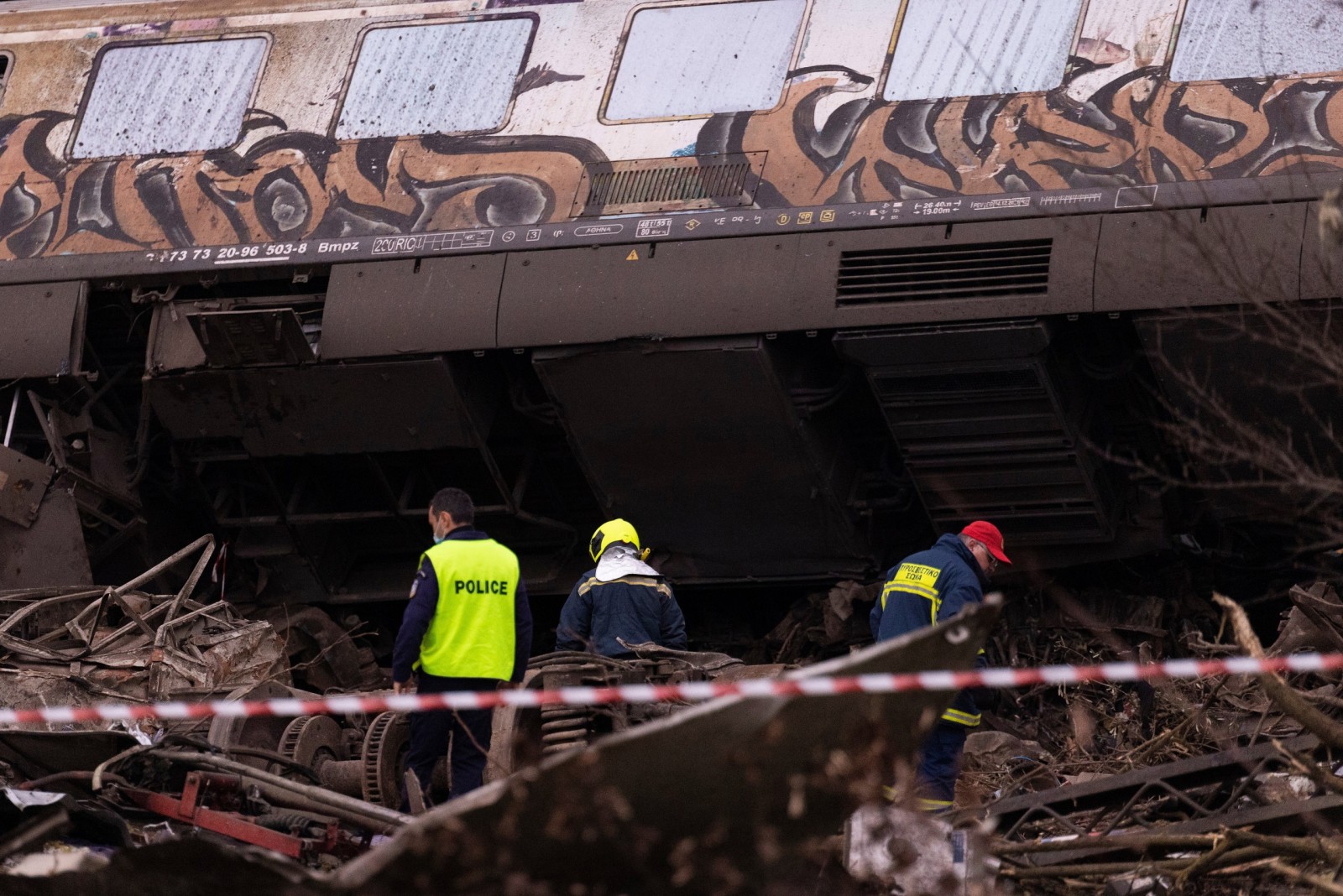 epa10496413 Rescuers at the scene of a train collision, near Larissa city, Greece, 01 March 2023. At least 32 people were killed and more than 85 were injured when a passenger train collided with a freight train, in Tempi, central Greece, near the city of Larissa, the Greek Fire Service said. Out of the 85 injured persons, 53 still remain in hospital, according to the spokesperson of the Fire Service, Vassilis Vathrokogiannis. Rescue workers continue the search for survivors focusing on the first two carriages of the passenger train.  EPA/ACHILLEAS CHIRAS