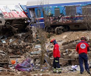 epa10497109 Rescuers at the scene of a train collision, near Larissa city, Greece, 01 March 2023. Fire fighter and ambulance service crews remain at the scene, while special crews were using cutting tools and blow torches to cut and prise apart the remains of the carriages to look for people or bodies possibly trapped inside. According to the latest update by the fire brigade spokesperson Vasilis Vathrakogiannis, the death toll was 36 so far and 66 people had been taken to hospital, six of which were admitted to ICUs.  EPA/ACHILLEAS CHIRAS