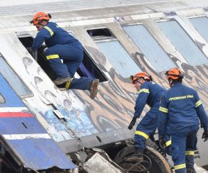 epa10497209 Firefighters and rescue crews work to extricate passengers from trains after a collision near Larissa city, Greece, 01 March 2023. Fire fighter and ambulance service crews remain at the scene, while special crews were using cutting tools and blow torches to cut and prise apart the remains of the carriages to look for people or bodies possibly trapped inside. According to the latest update by the fire brigade spokesperson Vasilis Vathrakogiannis, the death toll was 36 so far and 66 people had been taken to hospital, six of which were admitted to ICUs.  EPA/APOSTOLIS DOMALIS