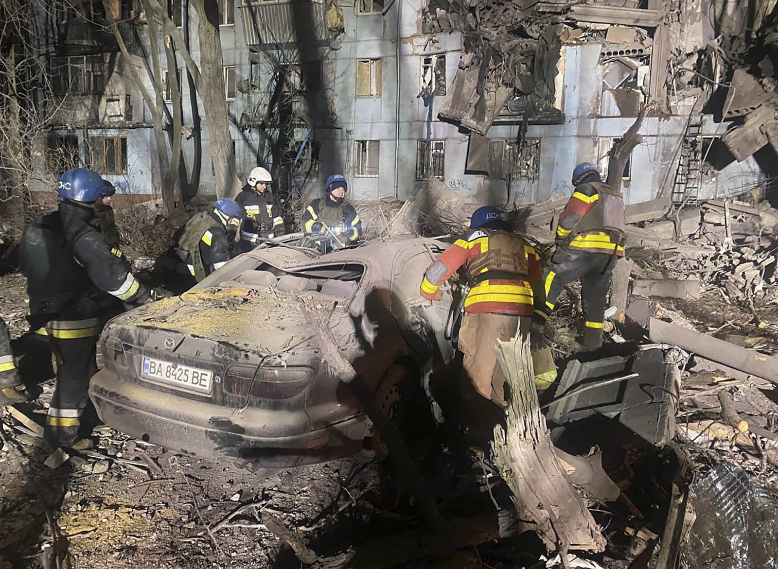 epa10498408 A handout photo made available by the State Emergency Service (SES) shows emergency services at the site of a damaged residential building in Zaporizhzhia, Ukraine, 02 March 2023. At least two people died and 11 others were injured after a rocket hit a five-story building in Zaporizhzhia, the State Emergency Service (SES) of Ukraine report. Russian troops entered Ukraine on 24 February 2022 starting a conflict that has provoked destruction and a humanitarian crisis.  EPA/STATE EMERGENCY SERVICE HANDOUT HANDOUT HANDOUT EDITORIAL USE ONLY/NO SALES