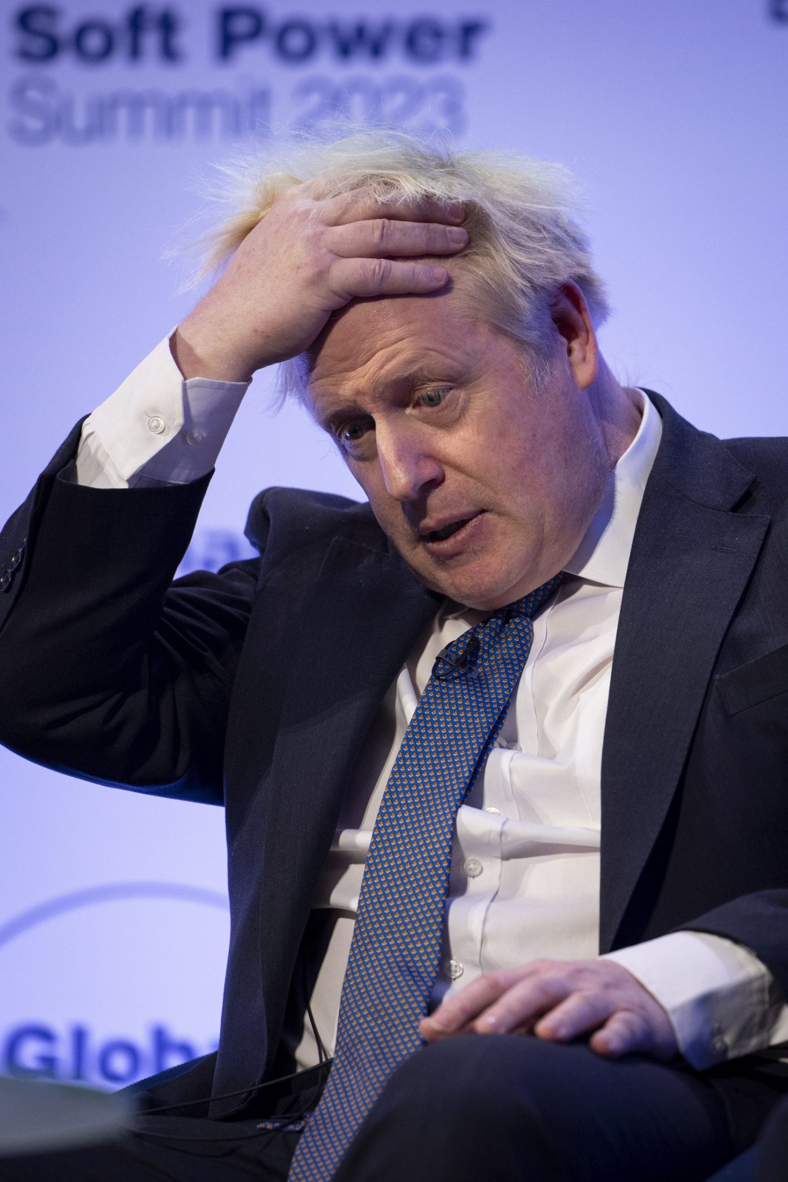 epa10498668 British former prime minister Boris Johnson speaks at Global Soft Power Summit 2023 at the Queen Elizabeth II Centre in London, Britain, 02 March 2023.  EPA/TOLGA AKMEN