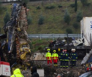 epa10498800 Firefighters and rescuers operate in the aftermath of a train collision near Larissa city, Greece, 02 March 2023. The rescue workers searching for missing passengers are continuing to focus their efforts on the third carriage and are now attempting to cut it up so that its weight can be more evenly distributed so it can be moved. Teams are also looking through the charred remnants of the first two carriages with the assistance of cranes, which are utterly destroyed and also caught fire, working with great care due to the highly dangerous conditions. The confirmed death toll from the deadly Tempi train disaster had climbed to 46 on Thursday 02 March morning, a fire brigade spokesperson said, while 57 people injured in the crash remained in hospital, six of them in ICUs.  EPA/APOSTOLIS DOMALIS