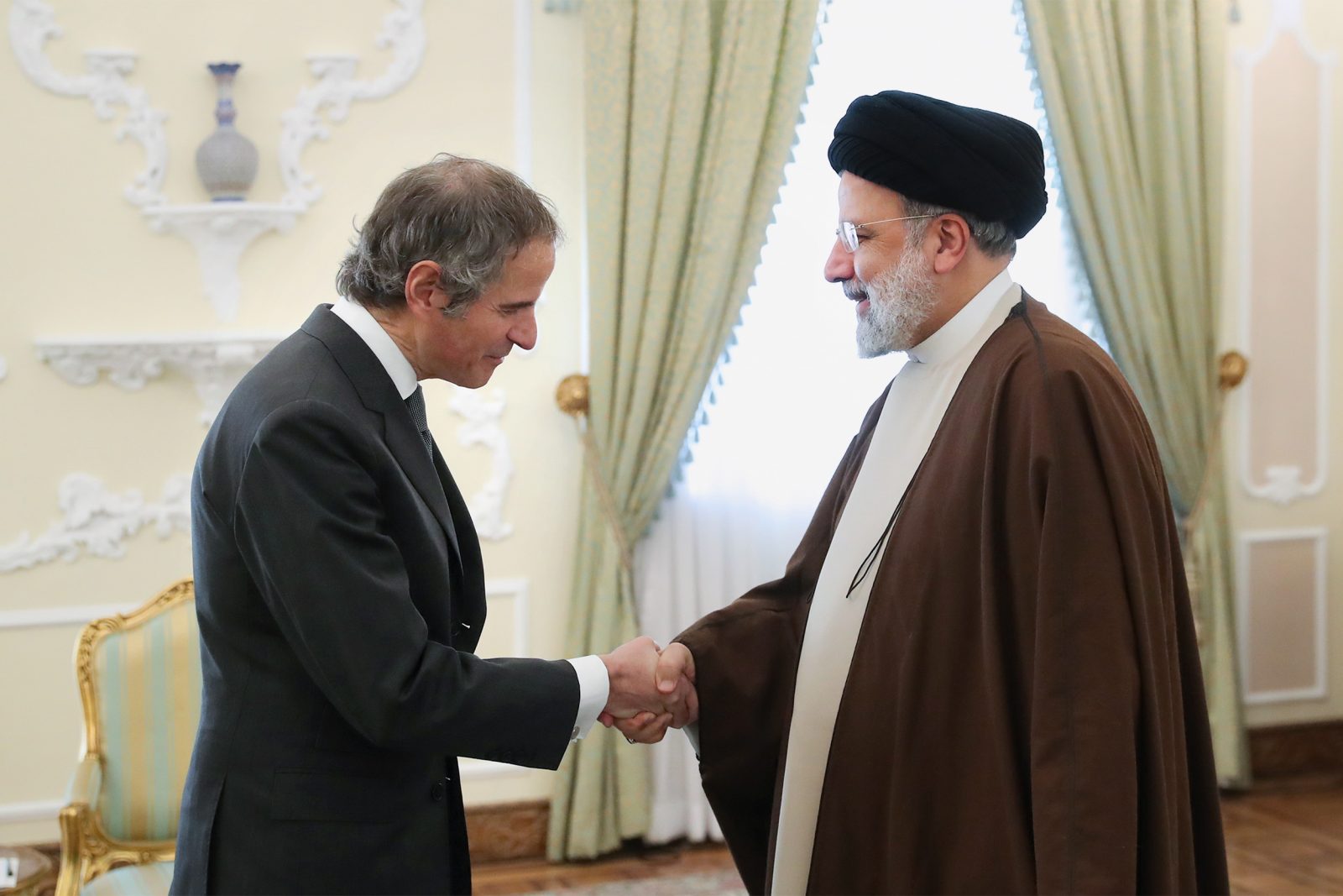 epa10502648 A handout photo made available by the Iranian presidential office shows, Iranian president Ebrahim Raisi greets Director General of the International Atomic Energy Agency (IAEA) Rafael Mariano Grossi (L) in Tehran, Iran, 04 March 2023. Grossi is in Tehran to meet with Iranian officials over Iran's nuclear policy.  EPA/IRAN PRESIDENTIAL OFFICE  HANDOUT EDITORIAL USE ONLY/NO SALES
