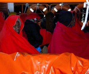 epa10504116 A group of migrants rescued by the Guardia Civil Maritime rescue service arrive at the port of Motril, Spain, 05 March 2023. 63 people, including eleven women and three children, were rescued near the coast of Granada.  EPA/ALBA FEIXAS