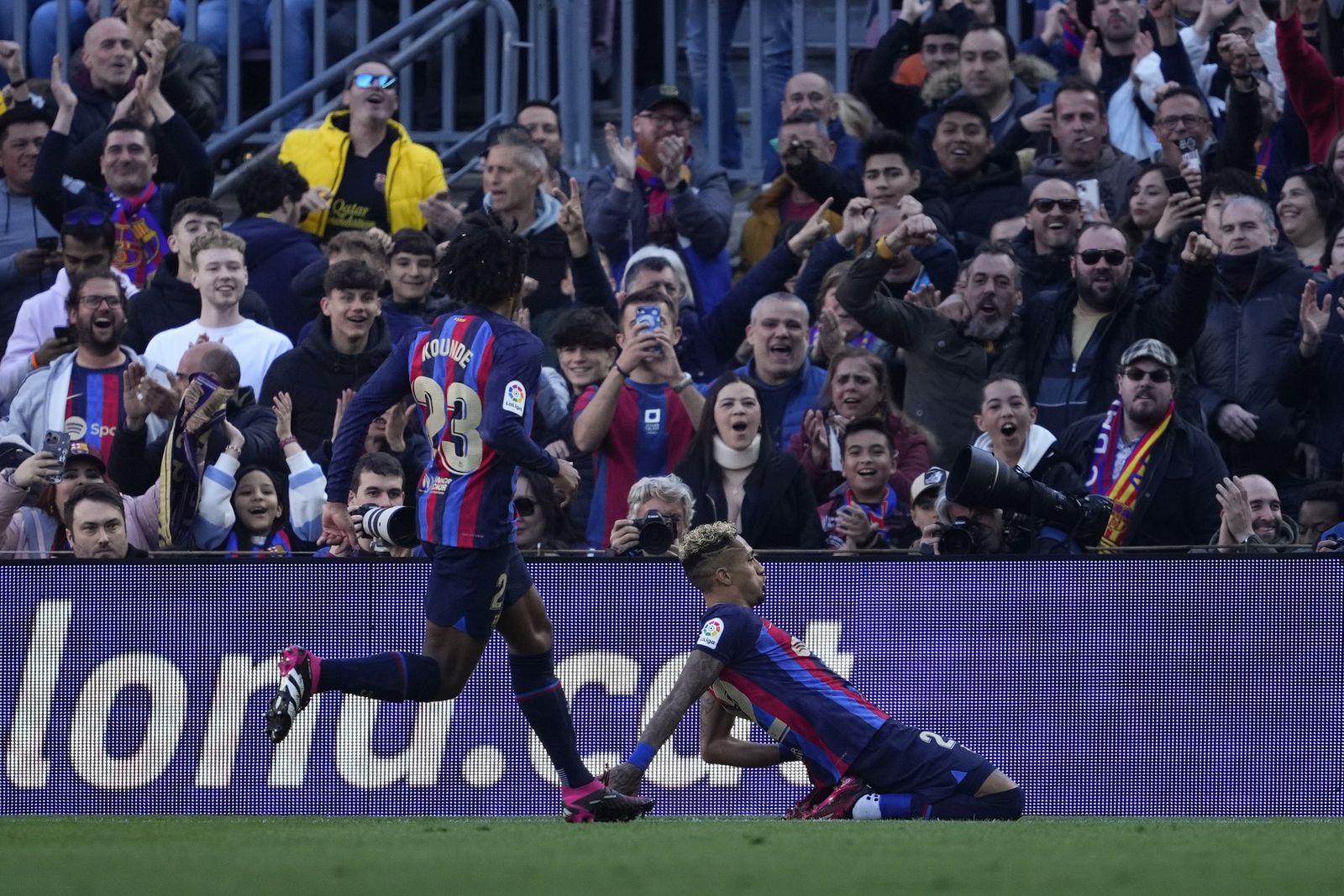 epa10504905 FC Barcelona's Raphinha (R) celebrates after scoring the 1-0 lead during the Spanish LaLiga soccer match between FC Barcelona and Valencia FC, in Barcelona, Spain, 05 March 2023.  EPA/Alejandro Garcia