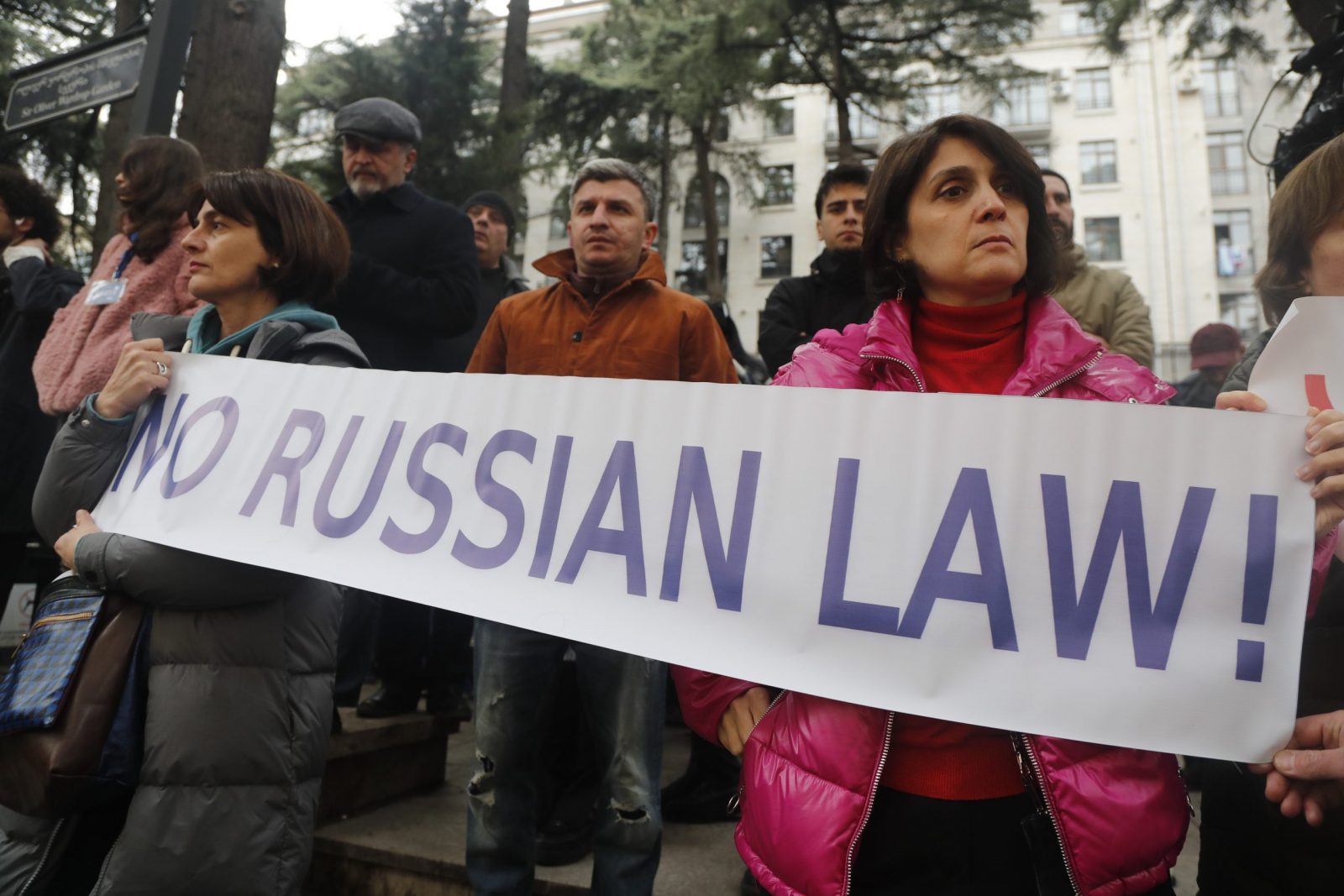epa10506213 People hold a banner as they take part in a rally to protest the so-called 'Foreign Agents Law' which the Georgian Parliament is going to adopt in the future, in front of the Parliament building in Tbilisi, Georgia, 06 March 2023. The law says that a Georgian legal entity, which is more than 20 percent funded from abroad, must be considered as an agent of foreign influence and has to register with the Georgian Ministry of Justice.  EPA/ZURAB KURTSIKIDZE