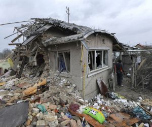 epa10511462 A Local man clears debris after two rocket's hit private buildings in the Zolochiv district near the Western Ukrainian city of Lviv, 09 March 2023. At least five people were killed during the attack according to regional official Maksym Kozytskyi. Ukrainian authorities said on 09 March that Russia fired 81 missiles across the country targeting critical infrastructure and residential buildings. The country's Defense Ministry confirmed that 34 cruise missiles were shot down. According to Ukraine's nuclear operator Energoatom, the Zaporizhzhia nuclear power plant (NPP) lost power as a result of the missile attacks, and was running on diesel generators.  EPA/MYKOLA TYS