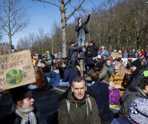 epa10514842 Climate activists from Extinction Rebellion (XR) block the A12 between the Ministry of Economic Affairs and Climate and the temporary House of Representatives in The Hague, the Netherlands, 11 March 2023.  EPA/SEM VAN DER WAL