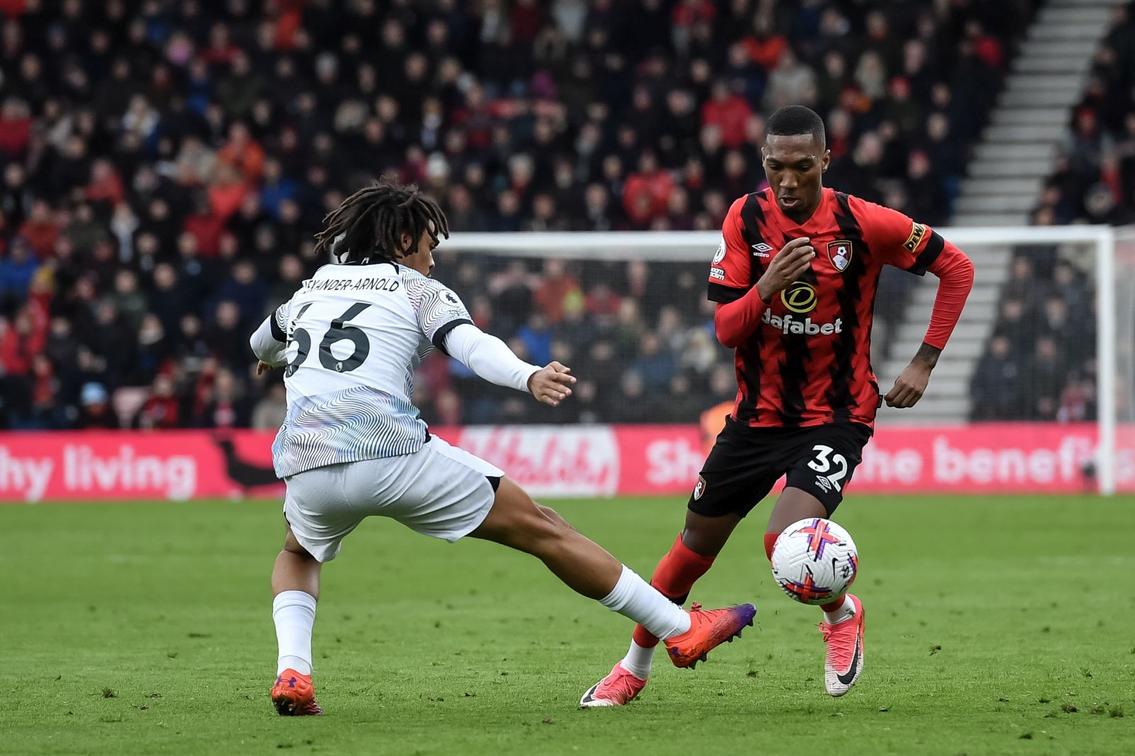 epa10515029 Trent Alexander-Arnold of Liverpool (L) in action against Jaidon Anthony of Bournemouth (R) during the English Premier League soccer match between AFC Bournemouth and Liverpool FC in Bournemouth, Britain, 11 March 2023.  EPA/Vince Mignott EDITORIAL USE ONLY. No use with unauthorized audio, video, data, fixture lists, club/league logos or 'live' services. Online in-match use limited to 120 images, no video emulation. No use in betting, games or single club/league/player publications