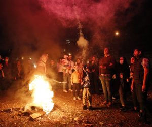 epa10522692 Iranians take part during a traditional fire feast called 'Charshanbeh Suri' in Tehran, Iran, 14 March 2023. The festival is held annually on the last Wednesday eve before the Persian New Year (Nowruz), which starts on 21 March, also marking the beginning of spring. Nowruz, which has been celebrated for at least three thousand years, is the most revered celebration in the greater Persian world, which includes the countries of Iran, Afghanistan, Azerbaijan, Turkey, and portions of western China and northern Iraq.  EPA/ABEDIN TAHERKENAREH