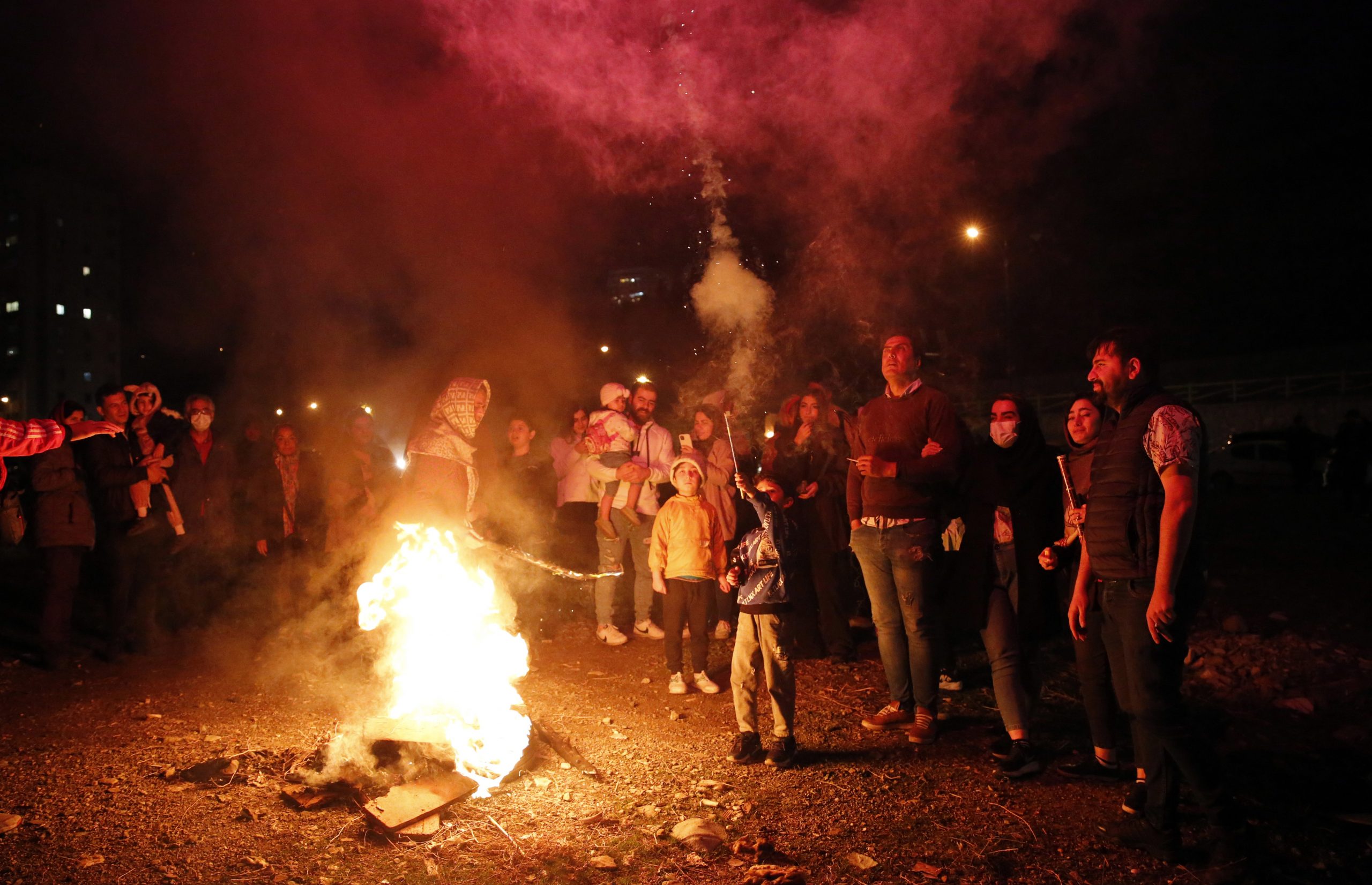 epa10522692 Iranians take part during a traditional fire feast called 'Charshanbeh Suri' in Tehran, Iran, 14 March 2023. The festival is held annually on the last Wednesday eve before the Persian New Year (Nowruz), which starts on 21 March, also marking the beginning of spring. Nowruz, which has been celebrated for at least three thousand years, is the most revered celebration in the greater Persian world, which includes the countries of Iran, Afghanistan, Azerbaijan, Turkey, and portions of western China and northern Iraq.  EPA/ABEDIN TAHERKENAREH