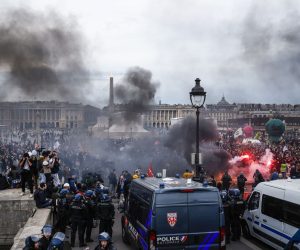 epa10526909 Thousands of protesters demonstrate on Place de la Concorde square, facing the French Parliament (National Assembly) in Paris, France, 16 March 2023, after French Prime Minister Borne used the controversial Article 49 paragraph 3 (49.3) of the Constitution to vote the pension reform law after the Senate voted in favour.  EPA/YOAN VALAT