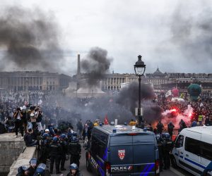 epa10526909 Thousands of protesters demonstrate on Place de la Concorde square, facing the French Parliament (National Assembly) in Paris, France, 16 March 2023, after French Prime Minister Borne used the controversial Article 49 paragraph 3 (49.3) of the Constitution to vote the pension reform law after the Senate voted in favour.  EPA/YOAN VALAT