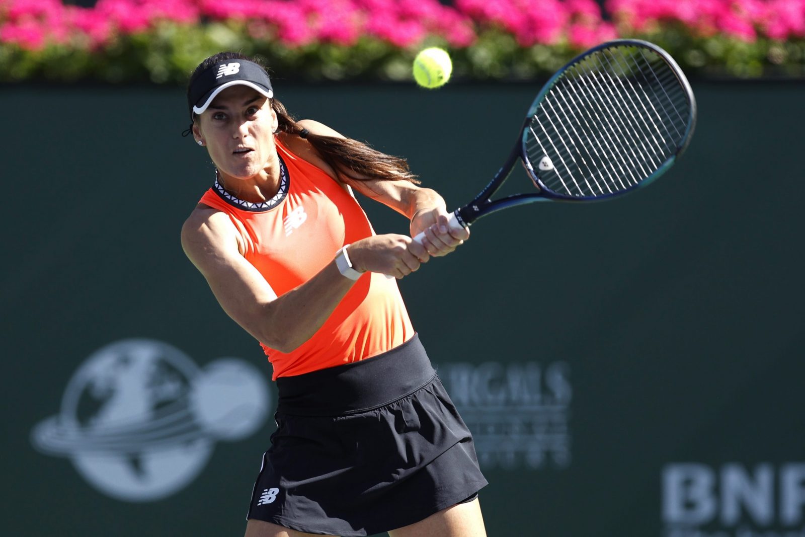 epa10527700 Sorana Cirstea of Romania in action against Iga Swiatek of Poland in the quarterfinal round of the BNP Paribas Open tennis tournament at the Indian Wells Tennis Garden in Indian Wells, California, USA, 16 March 2023.  EPA/JOHN G. MABANGLO
