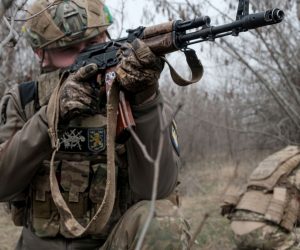 epa10528826 A member of Ukraine's Armed Forces 80th Separate Air Assault Brigade aims his weapon at their position, at an undisclosed location near the frontline city of Bakhmut, eastern Ukraine, 17 March 2023, amid Russia's invasion. The frontline city of Bakhmut, a key target for Russian forces, has seen heavy fighting for months. Russian troops on 24 February 2022, entered Ukrainian territory, starting a conflict that has provoked destruction and a humanitarian crisis.  EPA/MARIA SENOVILLA