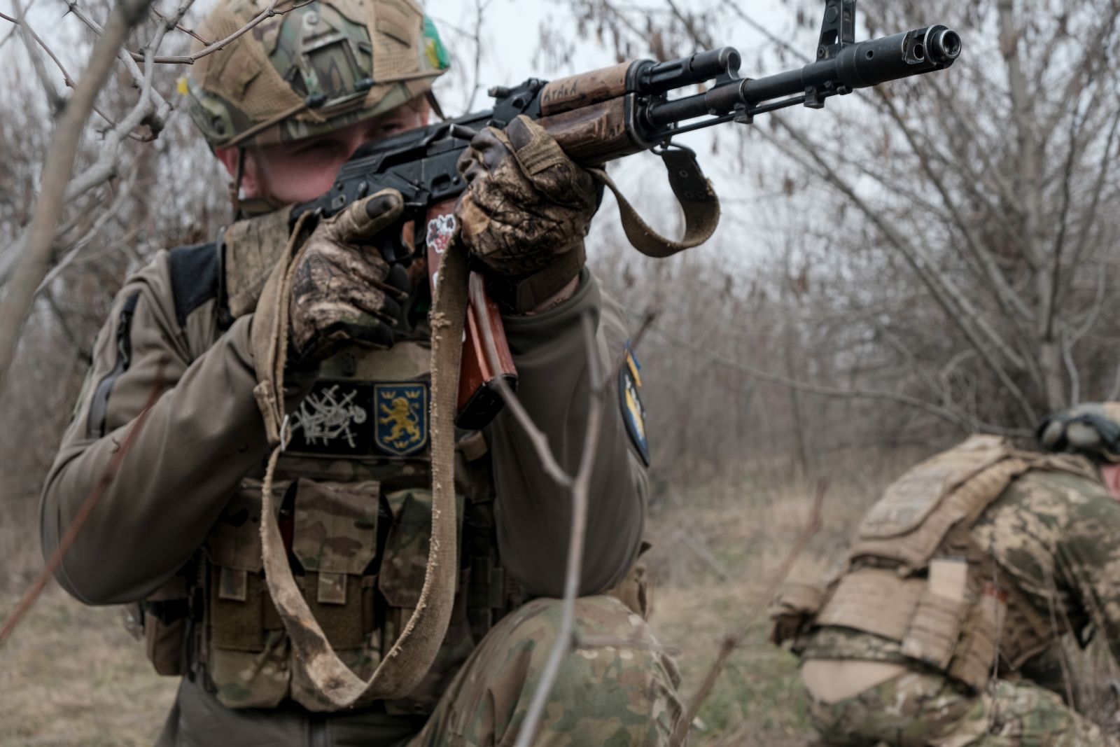 epa10528826 A member of Ukraine's Armed Forces 80th Separate Air Assault Brigade aims his weapon at their position, at an undisclosed location near the frontline city of Bakhmut, eastern Ukraine, 17 March 2023, amid Russia's invasion. The frontline city of Bakhmut, a key target for Russian forces, has seen heavy fighting for months. Russian troops on 24 February 2022, entered Ukrainian territory, starting a conflict that has provoked destruction and a humanitarian crisis.  EPA/MARIA SENOVILLA