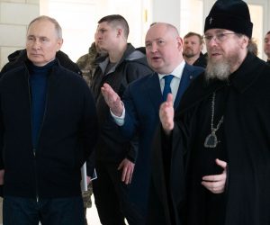 epa10530661 (L-R) Russian President Vladimir Putin, Sevastopol Governor Mikhail Razvozhayev, and Metropolitan Tikhon Shevkunov, chairman of the Patriarchal Council for Culture, visit a children's arts-and-crafts centre, part of Chersonesos Taurica historical and archeological park on the ninth anniversary of Russia's annexation of Crimea, in Sevastopol, Crimea, 18 March 2023. Russia in 2014 annexed the Black Sea peninsula, shortly after Crimeans voted in a disputed referendum to secede from Ukraine. Russia declared the annexation of Crimea on 18 March 2014, two days tafter Crimeans voted in a disputed referendum to secede from Ukraine. The United Nations General Assembly in the Resolution 68/262 condemned the referendum in Crimea stating it had 'no validity'. Since 2015, Russia marks the 'Day of Reunification of Crimea with Russia' as a holiday annually on 18 March.  EPA/SPUTNIK/KREMLIN POOL / POOL MANDATORY CREDIT