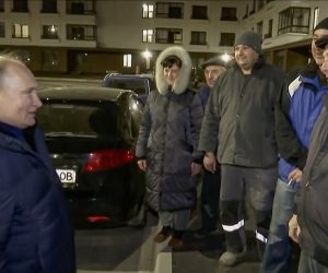 epa10532079 A still image taken from a handout video provided by the Russian President's press service on 19 March 2023 shows Russian President Vladimir Putin (L) speaks with locals during his visit to Mariupol, eastern Ukraine, late 18 March 2023. Putin visited the Russian-occupied city after he visited Crimea on the ninth anniversary of Russia's annexation of the Black Sea peninsula. According to the Kremlin, Putin had conversations with local residents, visited an apartment of one of the locals, assessed new roads, and followed the construction of new facilities in the city. On 24 February 2022 Russian troops entered the Ukrainian territory in what the Russian president declared to be a 'Special Military Operation', starting an armed conflict that has provoked destruction and a humanitarian crisis.  EPA/RUSSIAN PRESIDENT PRESS SERVICE/HANDOUT HANDOUT BEST QUALITY AVAILABLE HANDOUT EDITORIAL USE ONLY/NO SALES