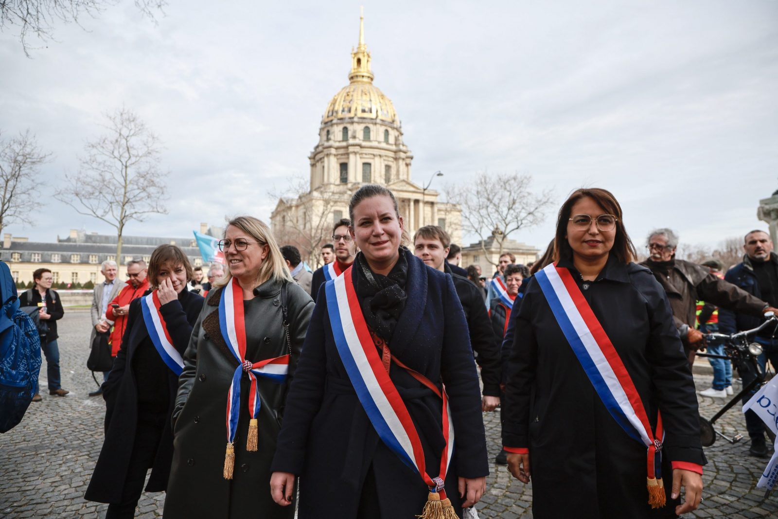epa10533572 President of the French leftist La France Insoumise (LFI) parliamentary group at the National Assembly Mathilde Panot (C), along with some colleagues, attend a demonstration over the Pension reform held by Unions of Retired people in Paris, France, 20 March 2023. Protests continued in France after French Prime Minister Elisabeth Borne announced on 16 March 2023 the use the Article 49 paragraph 3 (49.3) of the French Constitution to have the text on the controversial pension reform law be definitively adopted without a vote in the National Assembly (lower house of parliament). The bill would raise the retirement age in France from 62 to 64 by 2030.  EPA/Christophe Petit-Tesson