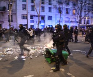 epa10534218 French riot police clash with protesters during a demonstration against the government pension reform at Vauban square in Paris, France, 20 March 2023. Protests continued in France after the French prime minister announced on 16 March 2023 the use of Article 49 paragraph 3 (49.3) of the French Constitution to have the text on the controversial pension reform law be definitively adopted without a vote in the National Assembly (lower house of parliament). The bill would raise the retirement age in France from 62 to 64 by 2030.  EPA/CHRISTOPHE PETIT TESSON