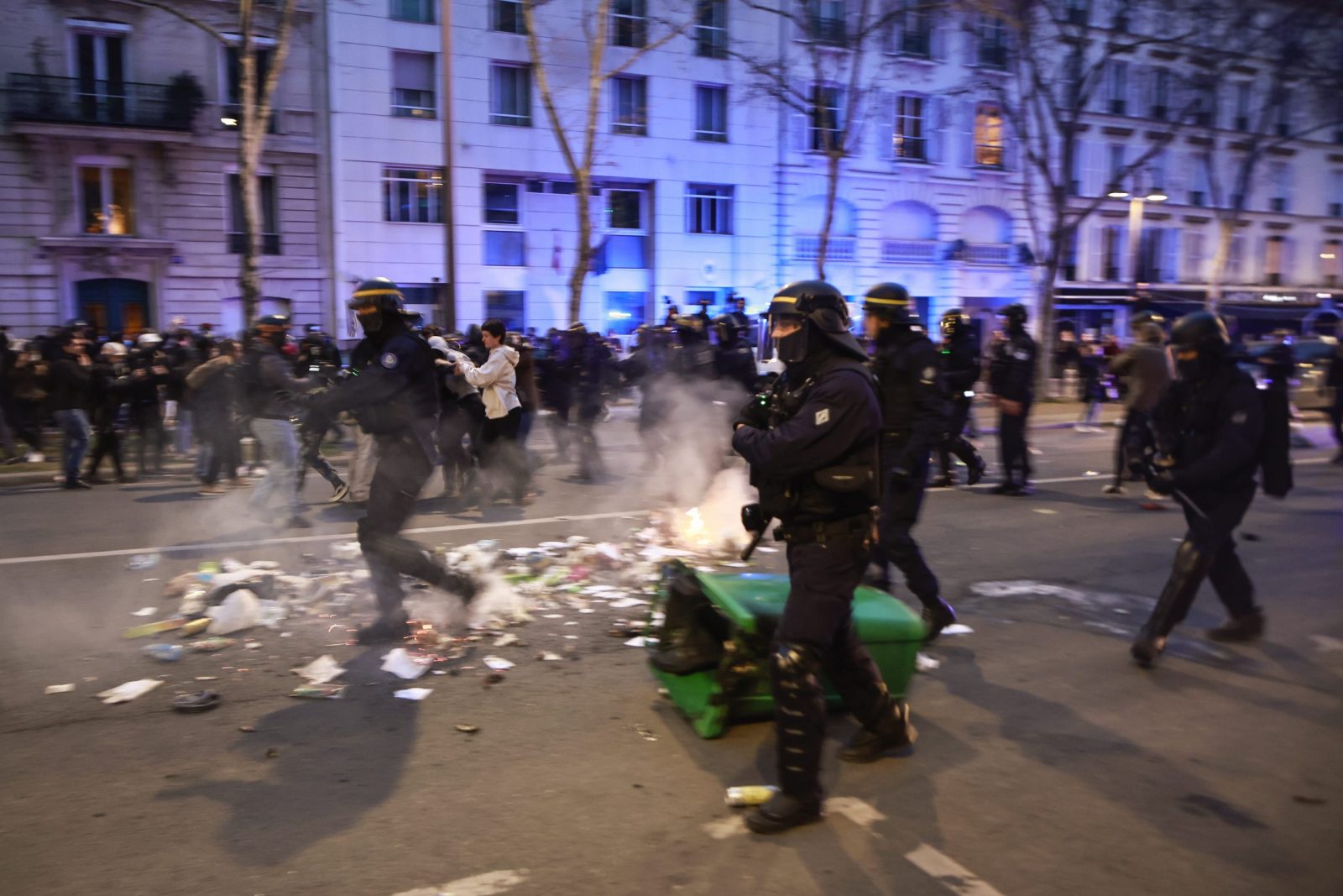 epa10534218 French riot police clash with protesters during a demonstration against the government pension reform at Vauban square in Paris, France, 20 March 2023. Protests continued in France after the French prime minister announced on 16 March 2023 the use of Article 49 paragraph 3 (49.3) of the French Constitution to have the text on the controversial pension reform law be definitively adopted without a vote in the National Assembly (lower house of parliament). The bill would raise the retirement age in France from 62 to 64 by 2030.  EPA/CHRISTOPHE PETIT TESSON