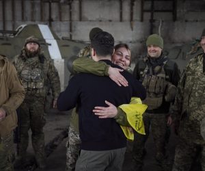 epa10536770 A handout photo made available by the Ukrainian Presidential Press Service shows Ukrainian President Volodymyr Zelensky (front) hugging a servicewoman as he visits the advanced positions of the Ukrainian military in the Bakhmut direction, during a working trip to the Donetsk region, at an undisclosed location in Ukraine, 22 March 2023, amid the Russian invasion of the country. Russian troops entered Ukrainian territory on 24 February 2022, starting a conflict that has provoked destruction and a humanitarian crisis.  EPA/PRESIDENTIAL PRESS SERVICE HANDOUT  HANDOUT EDITORIAL USE ONLY/NO SALES
