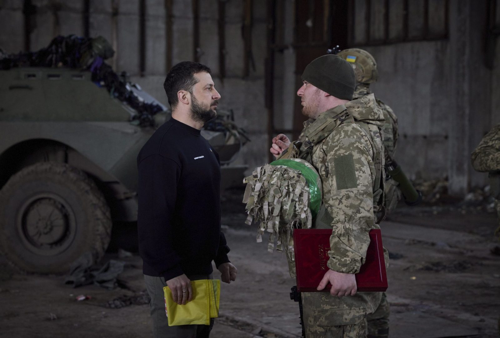 epa10536769 A handout photo made available by the Ukrainian Presidential Press Service shows Ukrainian President Volodymyr Zelensky (L) awarding a serviceman during a visit to the advanced positions of the Ukrainian military in the Bakhmut direction, part of a working trip to the Donetsk region, at an undisclosed location in Ukraine, 22 March 2023, amid the Russian invasion of the country. Russian troops entered Ukrainian territory on 24 February 2022, starting a conflict that has provoked destruction and a humanitarian crisis.  EPA/PRESIDENTIAL PRESS SERVICE HANDOUT  HANDOUT EDITORIAL USE ONLY/NO SALES