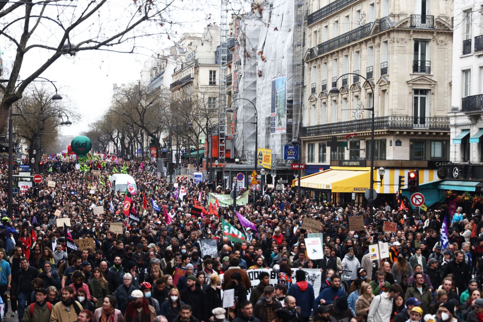 epa10538976 Thousands of people participate in a protest against the government's reform of the pension system in Paris, France, 23 March 2023. Protests continued in France after the French prime minister announced on 16 March 2023 the use of Article 49 paragraph 3 (49.3) of the French Constitution to have the text on the controversial pension reform law be definitively adopted without a vote in the National Assembly (lower house of parliament). The bill would raise the retirement age in France from 62 to 64 by 2030.  EPA/MOHAMMED BADRA