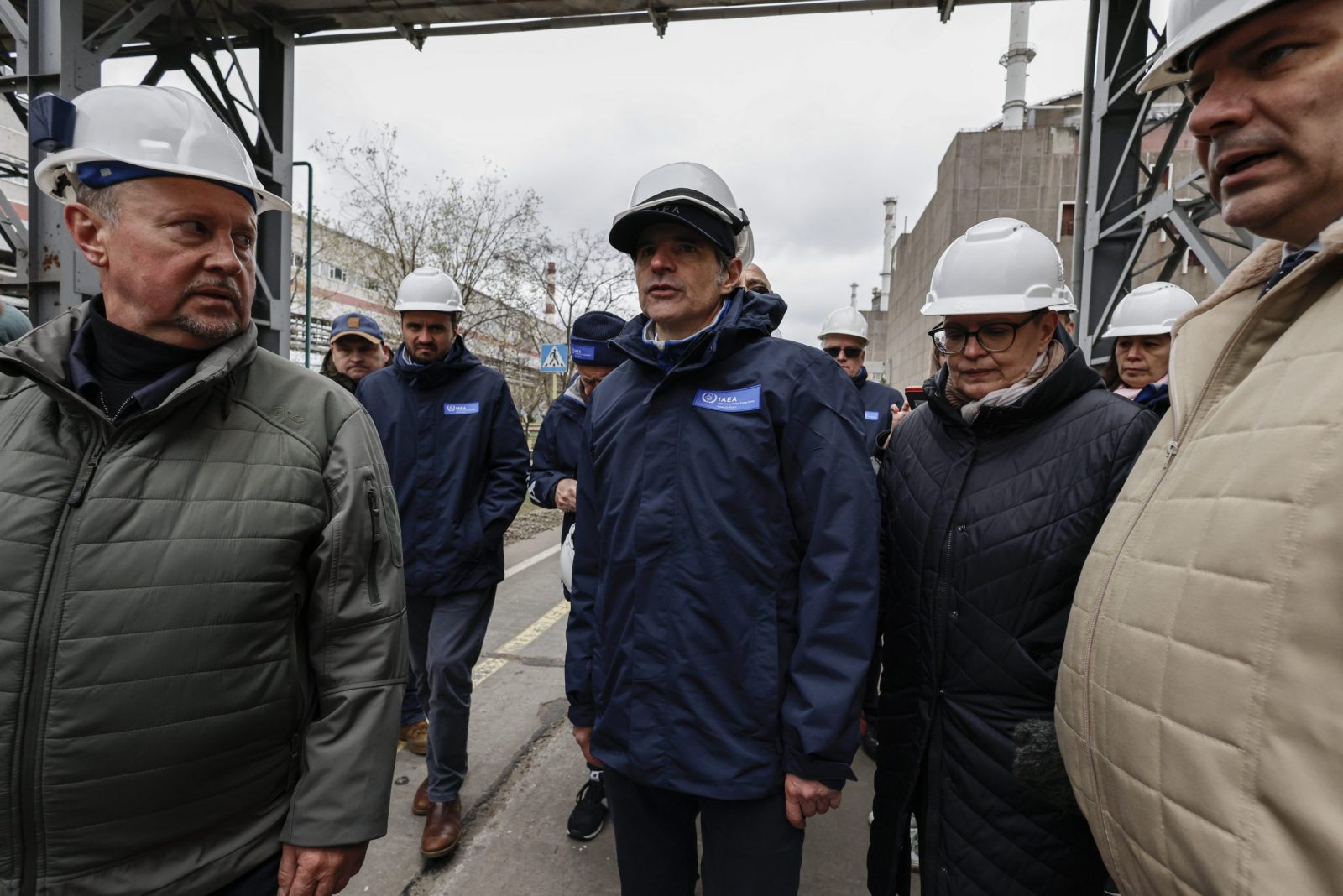 epa10548640 A picture taken during a visit to Enerhodar organized by the Russian military shows International Atomic Energy Agency (IAEA) Director-General Rafael Mariano Grossi (C) at the Zaporizhzhia Nuclear Power Plant (ZNPP) in Enerhodar, southeastern Ukraine, 29 March 2023. According to Ukrainian national nuclear energy company Energoatom, 'Grossi plans to see how the situation at the ZNPP has changed, talk to the staff working there, and act as a guarantor of the rotation of members of the IAEA’s permanent mission, which has been at the ZNPP since September 2022.'  EPA/SERGEI ILNITSKY