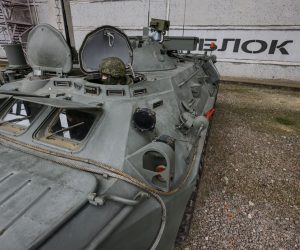 epa10549033 A picture taken during a visit to Enerhodar organized by the Russian military shows a Russian serviceman manning an armoured personnel carrier of the troops of chemical and biological protection monitoring the radiation situation at the Zaporizhzhia Nuclear Power Plant (ZNPP) during a visit by International Atomic Energy Agency (IAEA) Director-General Rafael Mariano Grossi in Enerhodar, southeastern Ukraine, 29 March 2023. According to Ukrainian national nuclear energy company Energoatom, 'Grossi plans to see how the situation at the ZNPP has changed, talk to the staff working there, and act as a guarantor of the rotation of members of the IAEA’s permanent mission, which has been at the ZNPP since September  EPA/SERGEI ILNITSKY