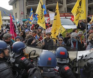 epa10550012 Members of French labour unions face police forces as they demonstrate ahead the arrival of French President Emmanuel Macron (not pictured), in Sainte-Savine-Le-Lac, South Eastern France, 30 March 2023. President Macron is expected to announce a national water management plan days after a violent demonstration by opponents of a proposed water reserve for agricultural irrigation.  EPA/SEBASTIEN NOGIER / POOL