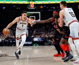 Mar 6, 2023; Denver, Colorado, USA; Denver Nuggets forward Michael Porter Jr. (1) controls the ball as center Nikola Jokic (15) screens against Toronto Raptors forward O.G. Anunoby (3) and forward Pascal Siakam (43) in the first quarter at Ball Arena. Mandatory Credit: Isaiah J. Downing-USA TODAY Sports Photo: Isaiah J. Downing/REUTERS