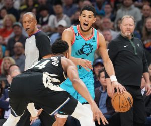 Mar 14, 2023; Phoenix, Arizona, USA; Milwaukee Bucks forward Giannis Antetokounmpo (34) guards Phoenix Suns guard Devin Booker (1) at Footprint Center. Mandatory Credit: Joe Camporeale-USA TODAY Sports Photo: Joe Camporeale/REUTERS