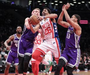 Mar 16, 2023; Brooklyn, New York, USA;  Brooklyn Nets guard Spencer Dinwiddie (26) drives past Sacramento Kings forwards Domantas Sabonis (10) and Keegan Murray (13) in the third quarter at Barclays Center. Mandatory Credit: Wendell Cruz-USA TODAY Sports Photo: Wendell Cruz/REUTERS