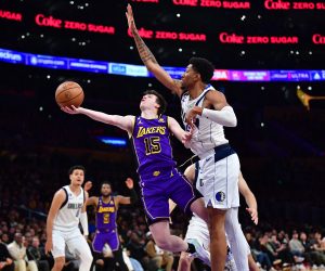 Mar 17, 2023; Los Angeles, California, USA; Los Angeles Lakers guard Austin Reaves (15) shoots against Dallas Mavericks forward Christian Wood (35) during the second half at Crypto.com Arena. Mandatory Credit: Gary A. Vasquez-USA TODAY Sports Photo: Gary A. Vasquez/REUTERS