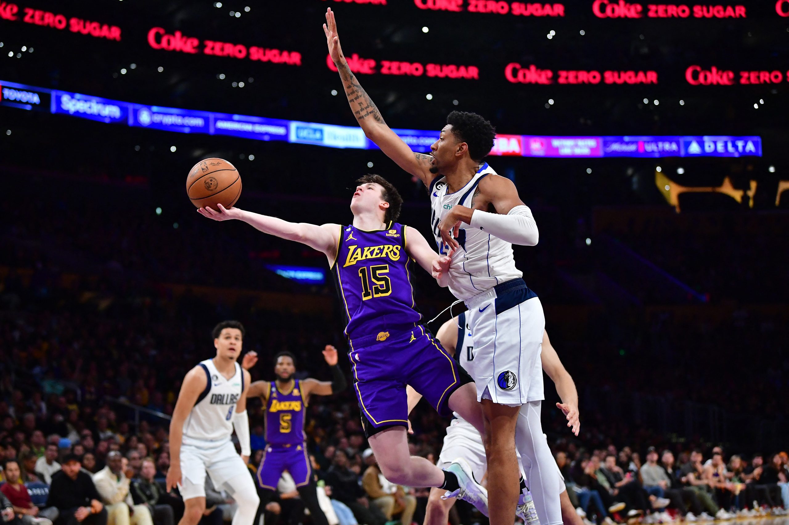 Mar 17, 2023; Los Angeles, California, USA; Los Angeles Lakers guard Austin Reaves (15) shoots against Dallas Mavericks forward Christian Wood (35) during the second half at Crypto.com Arena. Mandatory Credit: Gary A. Vasquez-USA TODAY Sports Photo: Gary A. Vasquez/REUTERS