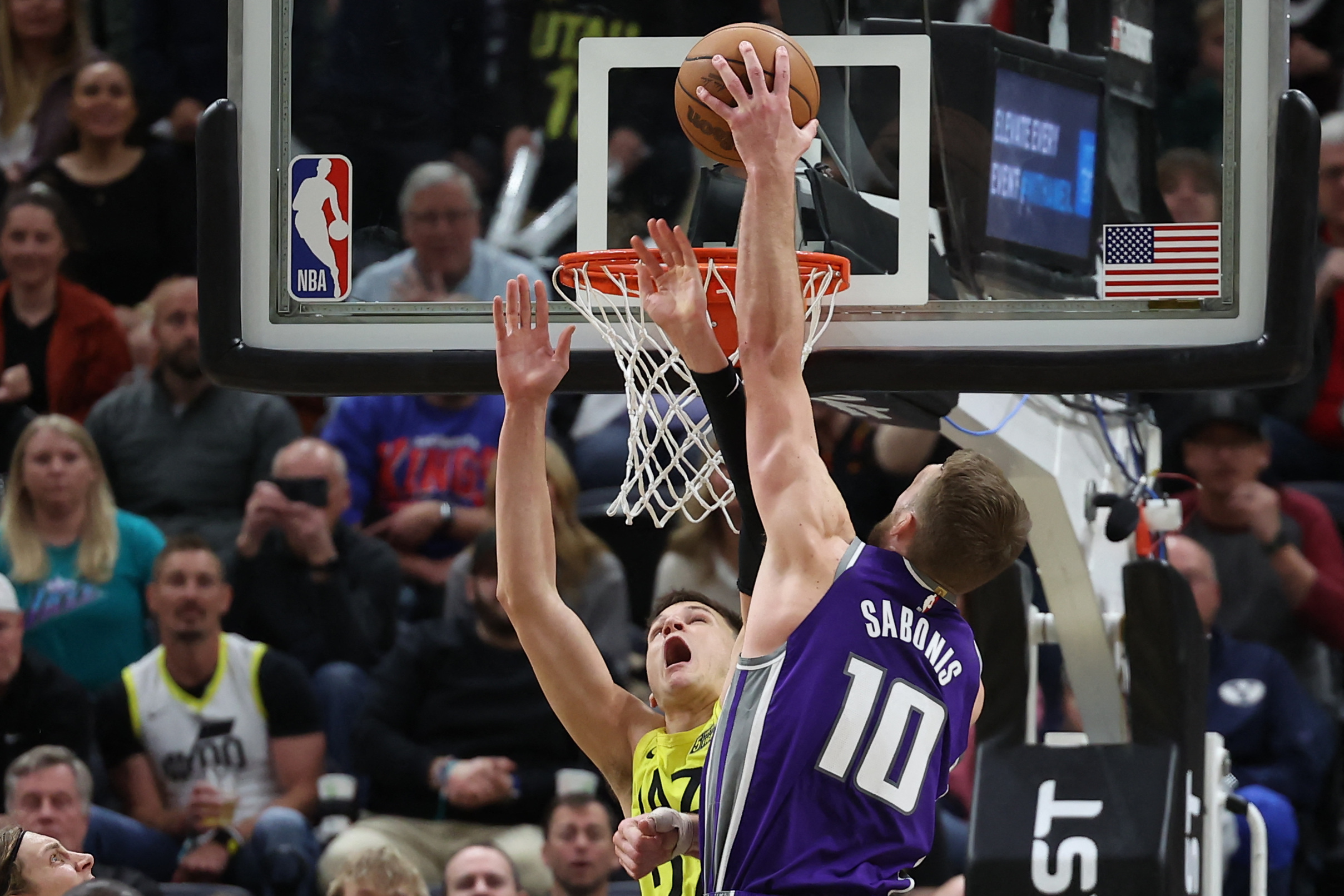 Mar 20, 2023; Salt Lake City, Utah, USA; Sacramento Kings forward Domantas Sabonis (10) dunks on Utah Jazz center Walker Kessler (24) in the fourth quarter at Vivint Arena. Mandatory Credit: Rob Gray-USA TODAY Sports Photo: Rob Gray/REUTERS