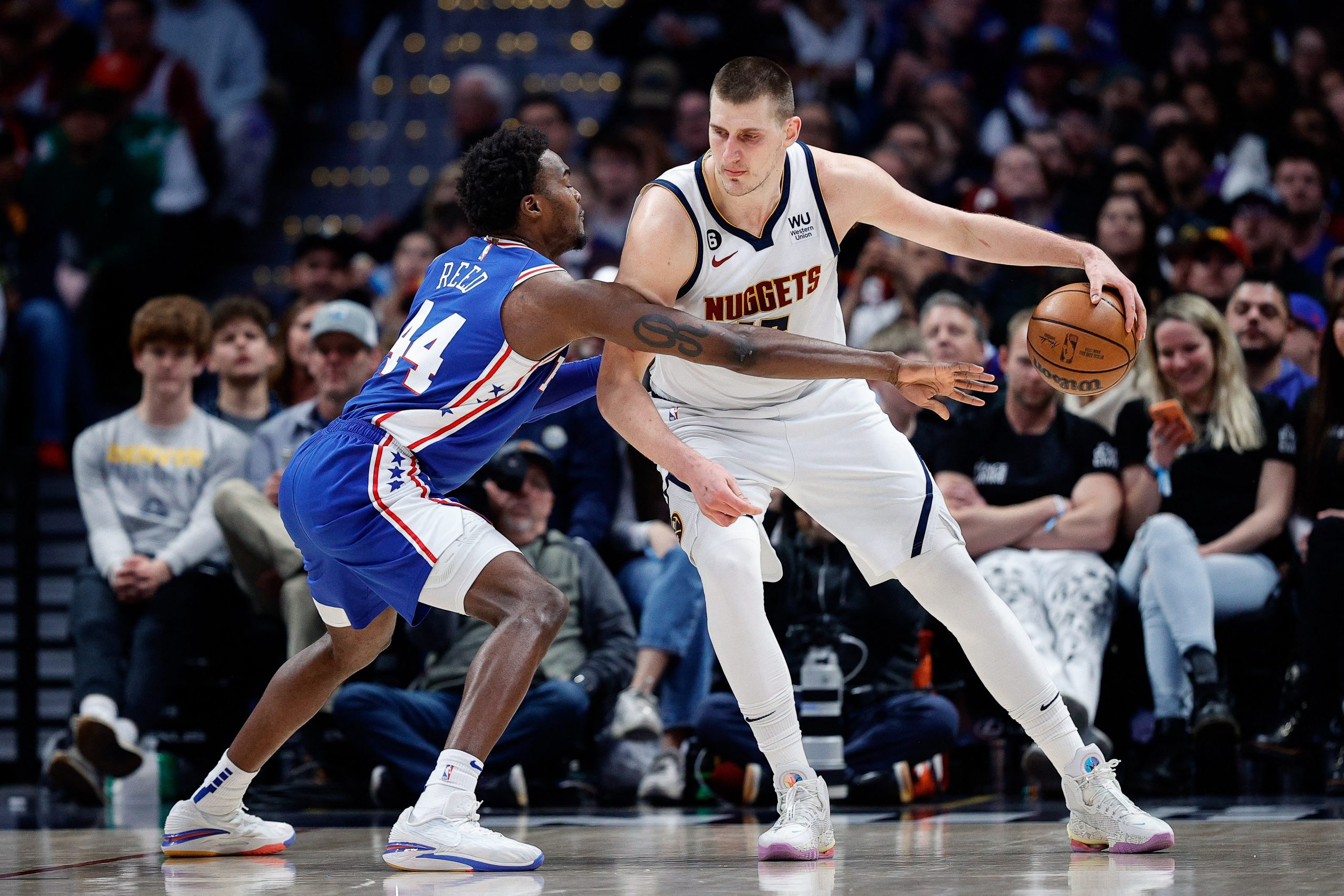Mar 27, 2023; Denver, Colorado, USA; Denver Nuggets center Nikola Jokic (15) controls the ball as Philadelphia 76ers forward Paul Reed (44) guards in the third quarter at Ball Arena. Mandatory Credit: Isaiah J. Downing-USA TODAY Sports Photo: Isaiah J. Downing/REUTERS