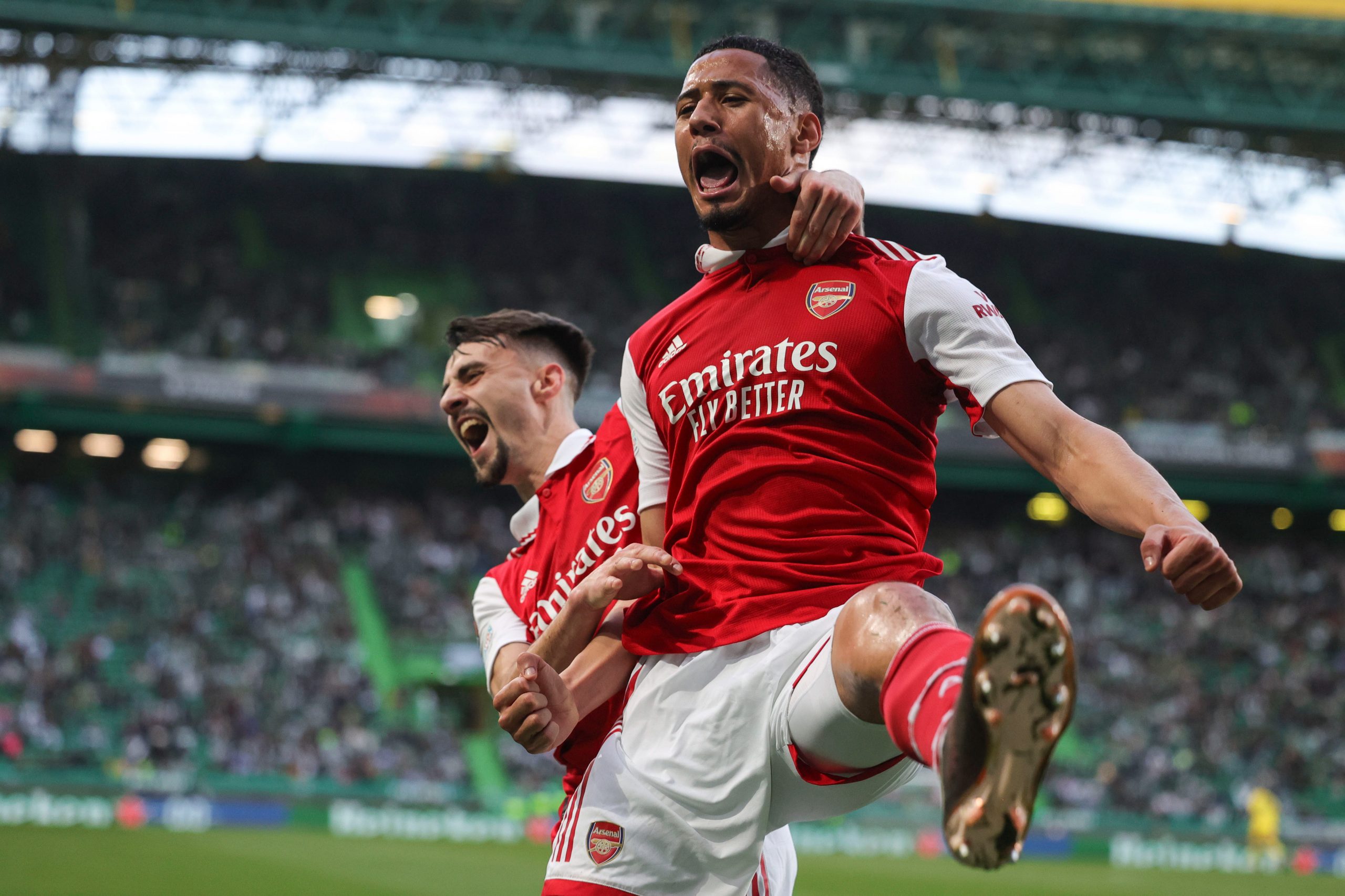 epa10511911 William Saliba (R) of Arsenal FC celebrates the 0-1 goal during the UEFA Europa League round of 16 first leg soccer match between Sporting CP and Arsenal FC, in Lisbon, Portugal, 09 March 2023.  EPA/MANUEL DE ALMEIDA