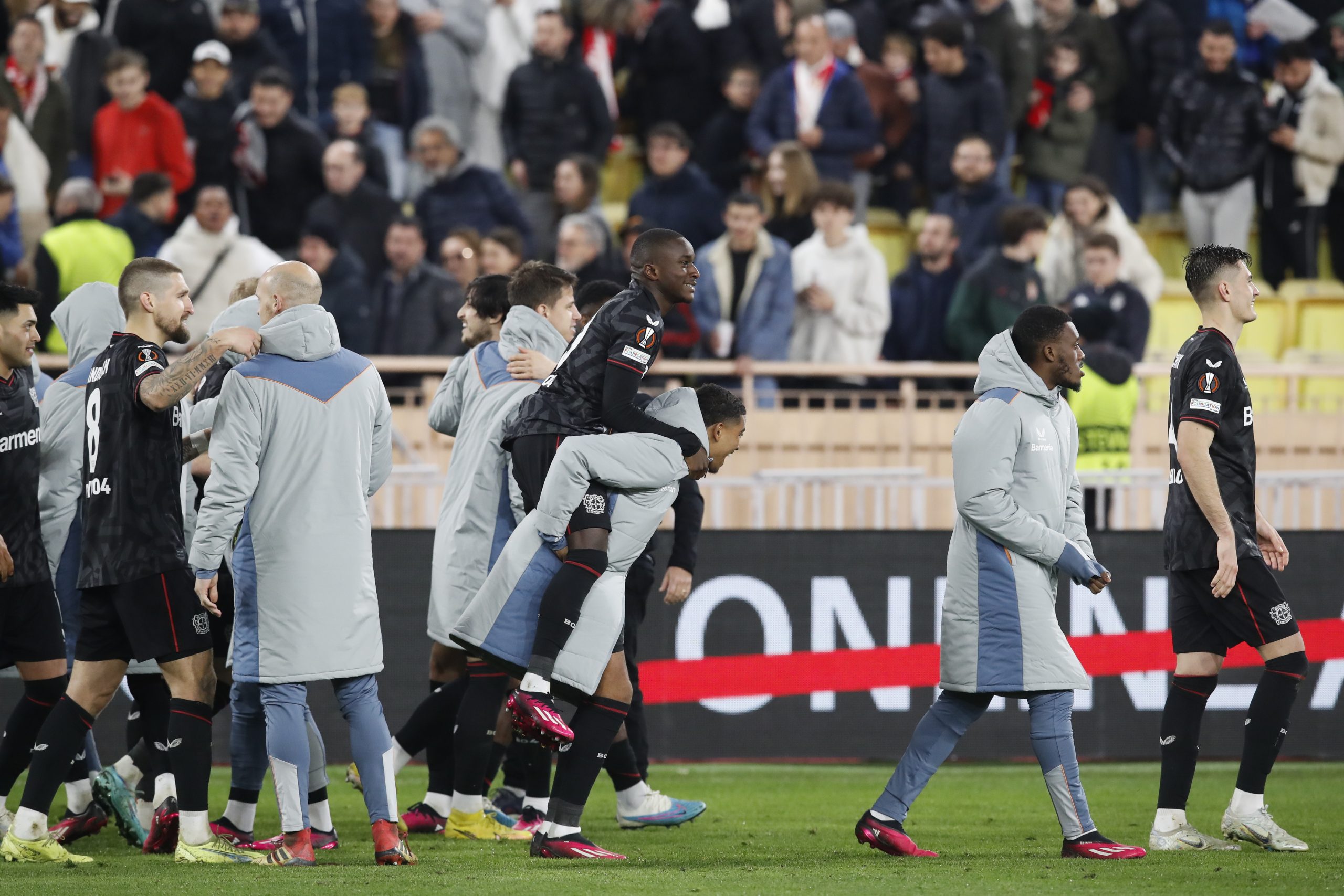 epa10486506 Leverkusen players celebrate after winning the penalty shoot-out of the UEFA Europa League play-off, 2nd leg match between AS Monaco and Bayer Leverkusen in Monaco, 23 February 2023.  EPA/Sebastien Nogier