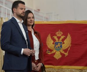 epa10531936 Montenegro's Presidential candidate Jakov Milatovic (L) and his wife Milena Milatovic (R) wait to cast their ballots during the first round of the Presidential elections in Podgorica, Montenegro, 19 March 2023. Some 540,000 eligible voters are casting their ballots to chose the next President of Montenegro.  EPA/BORIS PEJOVIC